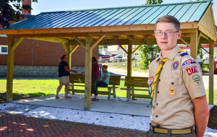 Alex Stewart is seen Thursday with a new outdoor classroom at Lincoln School in Augusta. Stewart organized the classroom's construction as part of an Eagle Scout project. Stewart, of Augusta, is a Life Scout and member of Boy Scout Troop 479 in China.