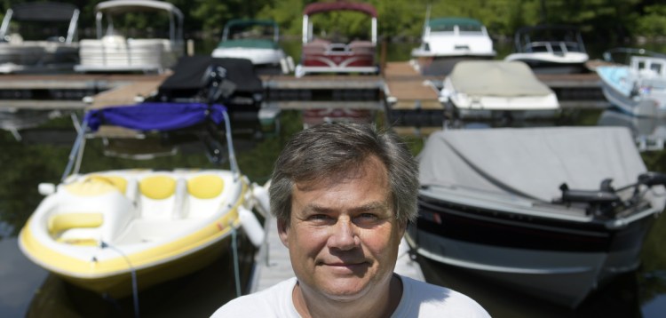 Shawn Grant on the docks July 16 at Brightside Marina, the business he owns in Belgrade Lakes Village. Grant is appealing the denial of a commercial business permit for the marina he has operated for 10 years on Hulin Road.