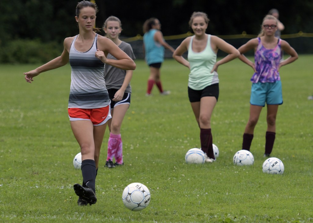 Members of the Monmouth girls soccer team works on drills during an Aug. 15 practice in Monmouth.