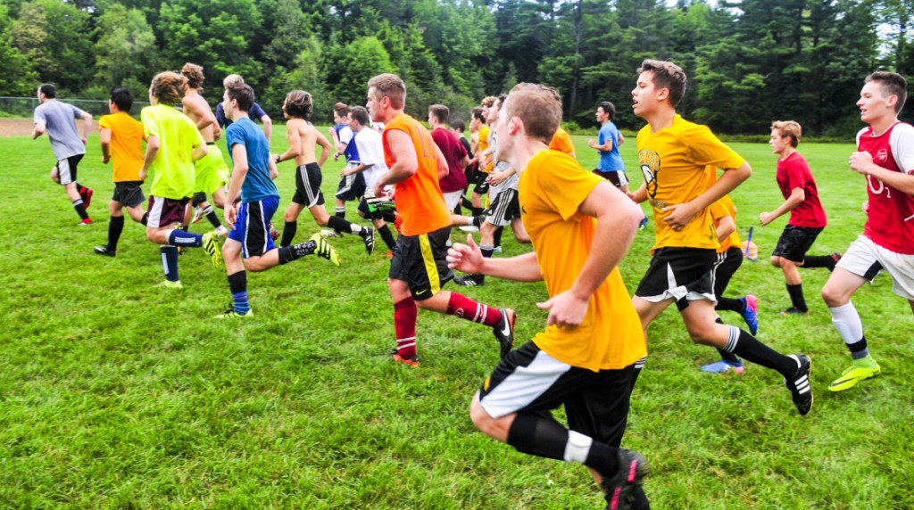 Staff photo by Andy Molloy
Maranacook boys soccer players run during an early morning practice on Aug. 16 in Readfield.
