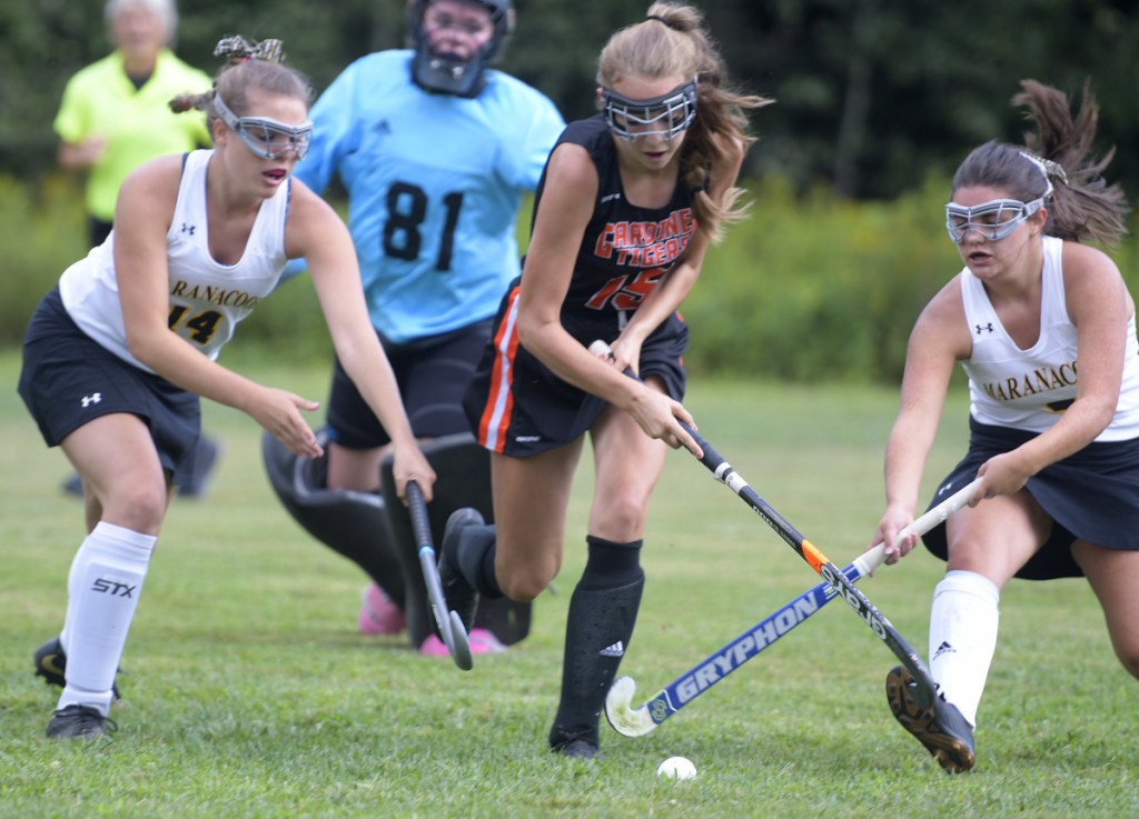 Maranacook's Abigail Whitcomb, right, and Haylee Weeks, left, pursue Gardiner's Maggie Bell during a game Thursday in Readfield.