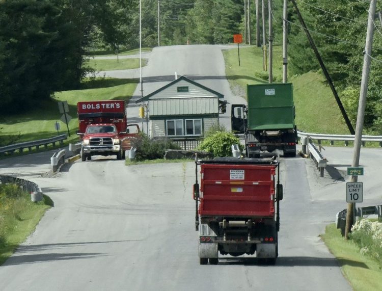 Trucks from the Bolsters and CMD trash hauling companies stop at a weigh station Thursday at Waste Management's 933-acre Crossroads facility in Norridgewock. Waste Management is proposing to expand the landfill by 51 acres on land it owns, upgrade the transfer station used by nine towns, and increase waste reduction and recycling by adding a textile recycling program and a composting program.