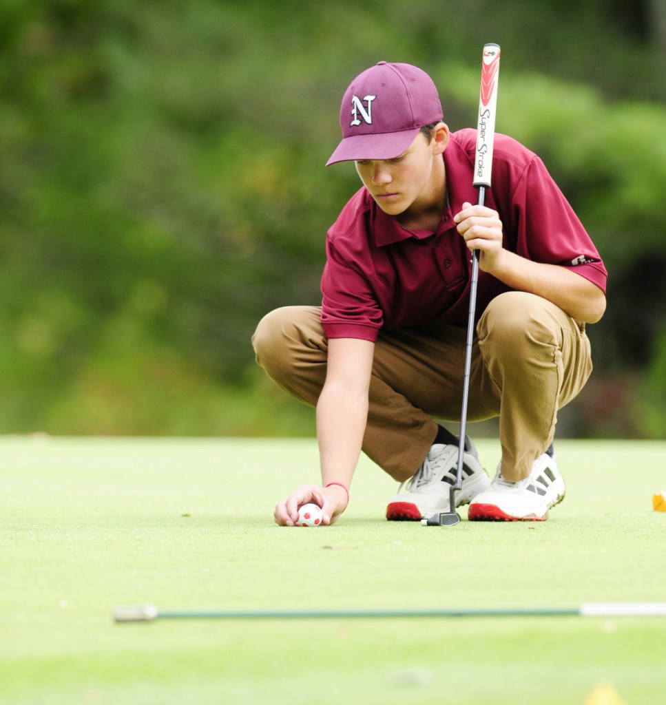 Staff file photo by Joe Phelan 
 Easy does it: Nokomis' Sam Smestad lines up a putt during the team state golf championships last season at Natanis Golf Course in Vassalboro.