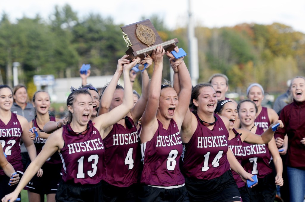 Maine Sunday Telegram photo by Shawn Patrick Ouellette 
 The MCI field hockey team celebrates after winning the Class B state championship last season over York at Falmouth High School.