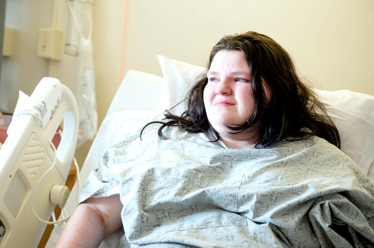 Ashley Mitchell, 18, and her sister were attacked by a pit bull in Rumford on Wednesday. Mitchell has had one surgery on her leg and expects to have another.