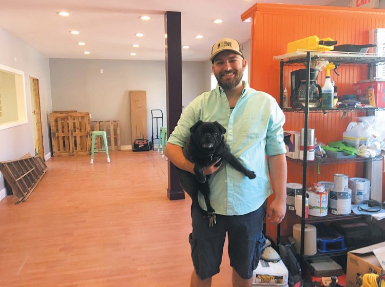 Sam Wilson and his dog Gir at Black Pug Brewing at 30 Bath Road. Wilson and a business partner hope to have the brewery open by October.