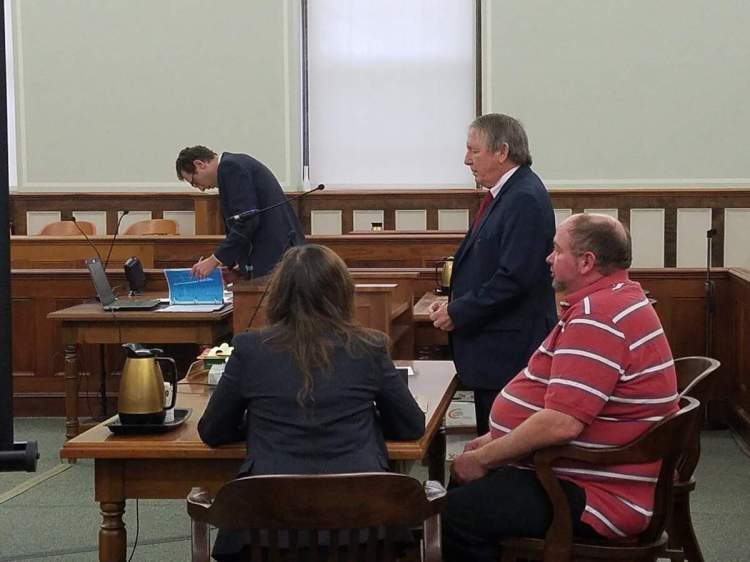 Alan B. Norwood Jr., right, is being sued over the sinking of a lobster boat owned by Joshua Hupper of Tenants Harbor. Norwood is pictured here during a criminal trial held in October 2017. He was acquitted of the criminal charge of aggravated criminal mischief for allegedly paying his sternman to sink Hupper's boat.