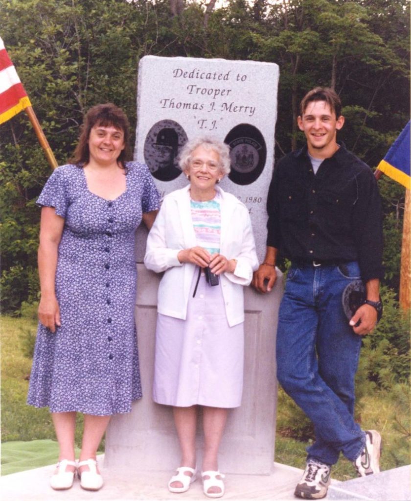 Trooper Thomas Merry's widow, Debbie; his mother, Erla; and his son, Ben, attend the dedication of a granite monument placed in Trooper Merry's honor in 1998. Nearly 200 people attended the dedication along U.S. Route 2 in Palmyra. Now the monument has been moved to a more visible site nearby.