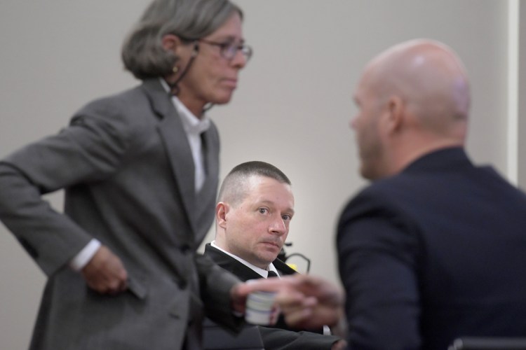 Scott Bubar, center, observes his attorneys, Lisa Whittier and Scott Hess, as they prepare for opening remarks Monday at his trial in Augusta.