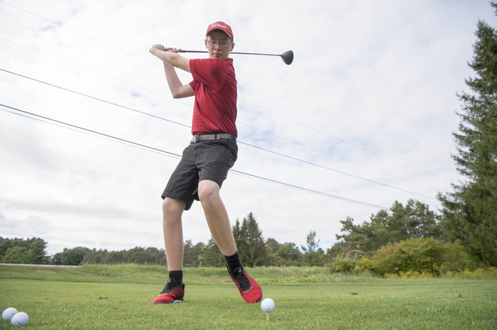 Cony golfer Alex Stewart takes a swing last week at Natanis Golf Course in Vassalboro.