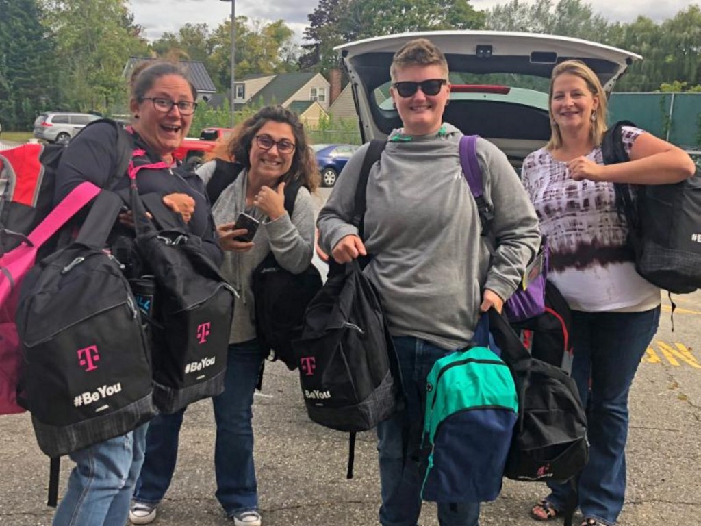 T-Mobile employees, from left, Amber Snell, Johnna Hatt, Kristin Mills and Amanda Scott, delivered more than 55 backpacks stuffed with schools supplies to the Alfond Youth Center in Waterville.