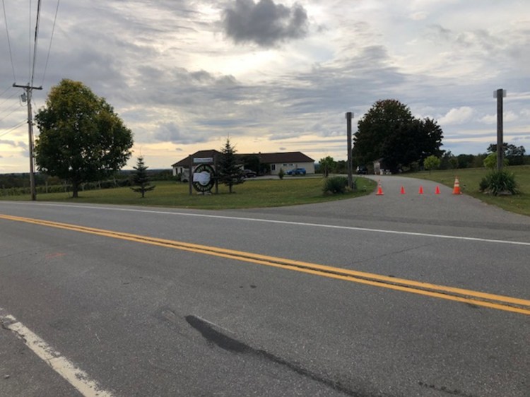 Orange traffic cones stand at the end of the driveway to Younity Winery and the Blakney home on Thursday, indicating the business is closed. A motorist killed Clement Blakney Wednesday in the area of the black mark, according to investigators.