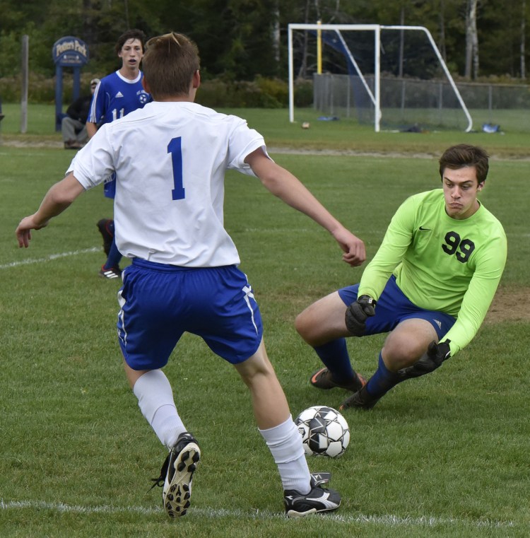 Mt. Abram goalie Jack Deming makes a save on a shot by Oak Hill's Brady Bangs during a Mountain Valley Conference game Thursday in Salem.