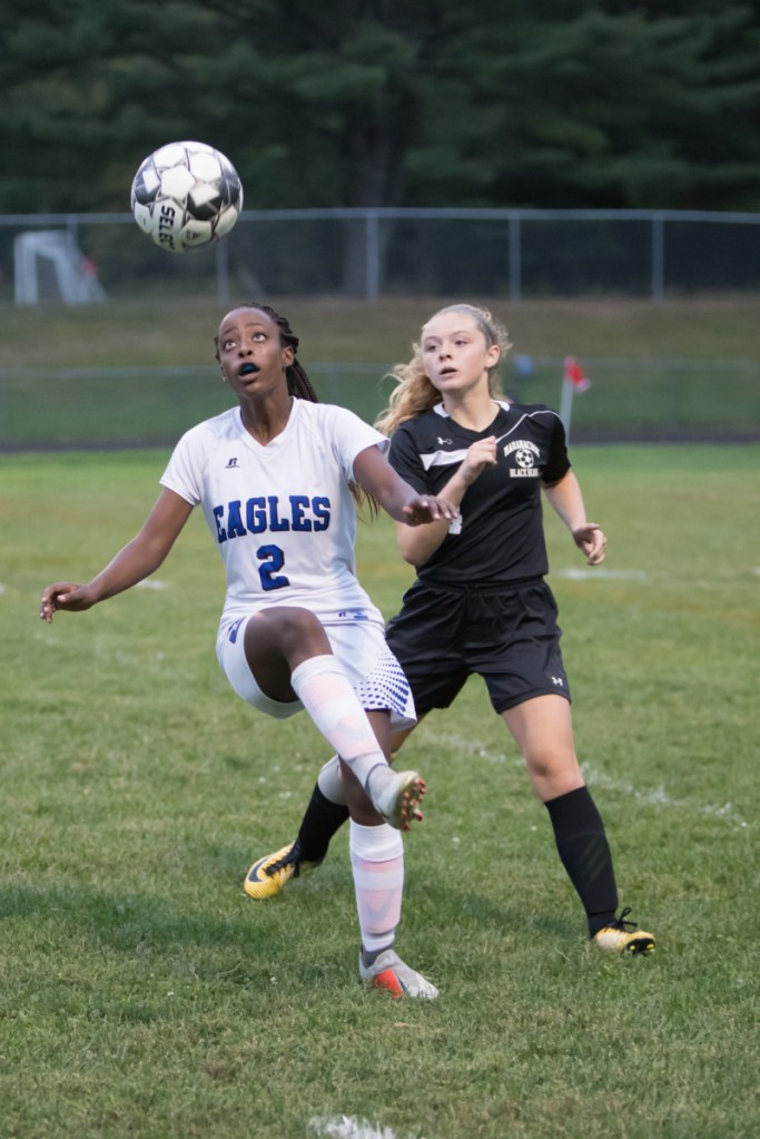 Erskine's Haymanot Maynard, left, and Maranacook's Anna Drillen battle for the ball Thursday in Readfield.