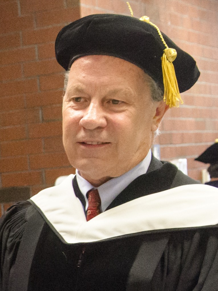 Keynote speaker Ben Bradlee Jr. appears before the annual University of Maine at Augusta convocation on Friday at the Augusta Civic Center.