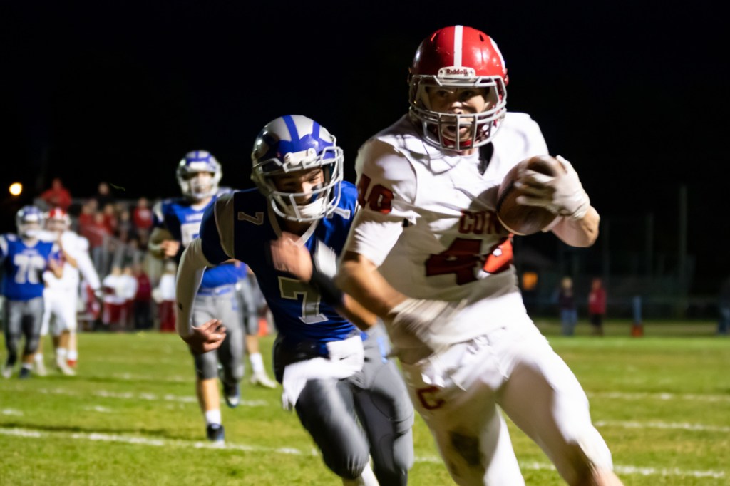 Cony's Matt Wozniak runs in for a touchdown against Lawrence on Friday in Fairfield.