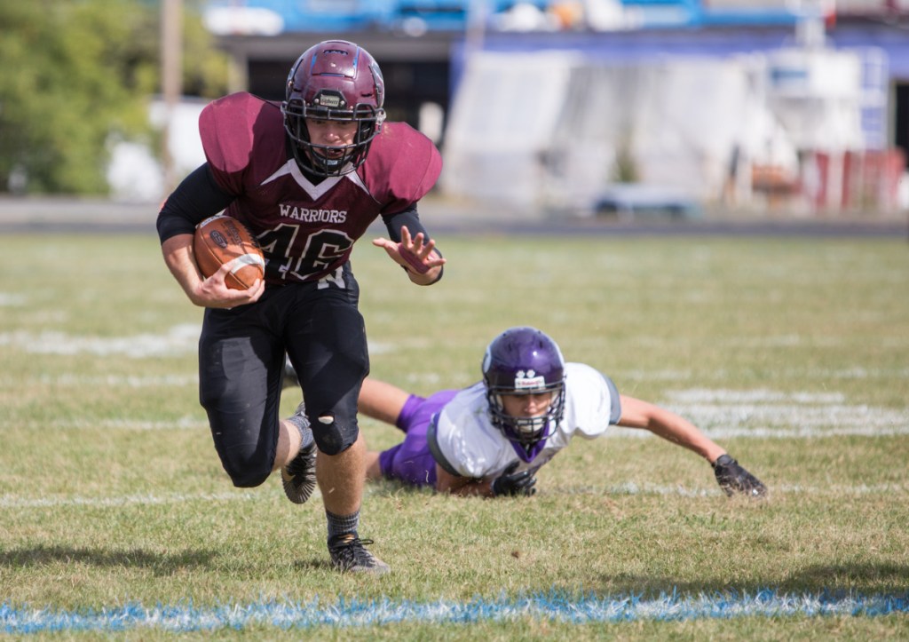 Nokomis running back Alex Costedio heads upfield as Waterville defender can Nicholas Wildhaber can only watch during a Class C North game earlier this season in Newport.