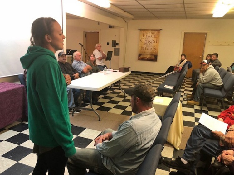 Kassie Dwyer, a 29-year-old Athens farmer, mother and schoolteacher, explains the town's food sovereignty initiative Tuesday night at a special town meeting. The measure passed with no opposition.