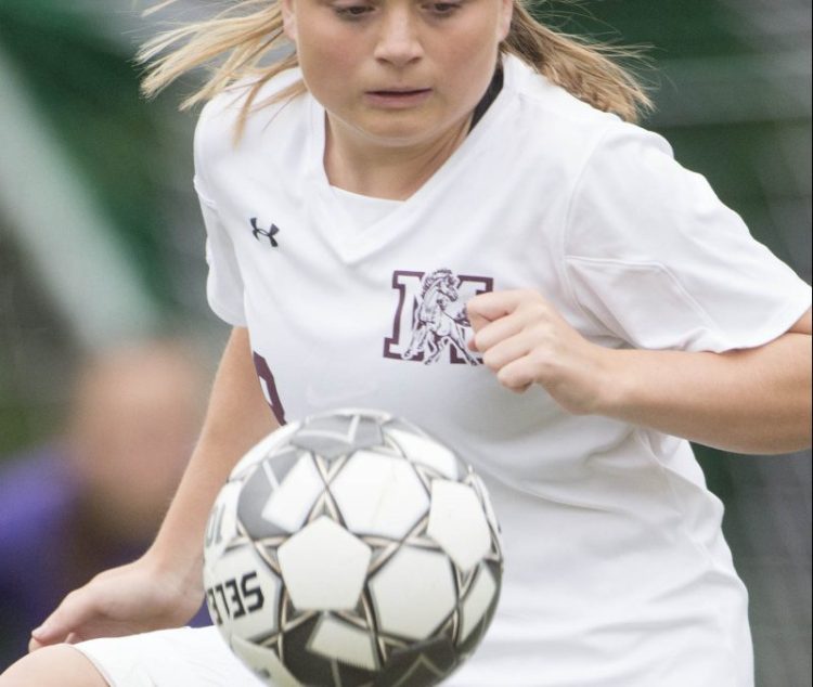 Monmouth's Alicen Burnham gains control of the ball during a game against Carrabec earlier this season in North Anson.