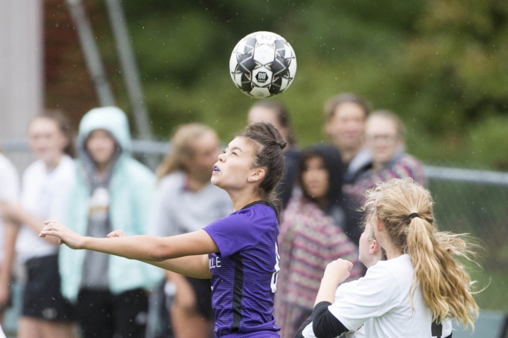 Waterville's Paige St. Pierre gets her head on the ball during a Kennebec Valley Athletic Conference game against Maranacook on Tuesday at Webber Field in Waterville.