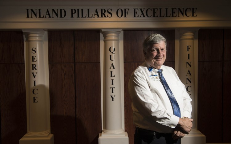 John Dalton, president of Inland Hospital, poses for a portrait in the lobby at Inland on Friday. Inland and other hospitals affiliated with Eastern Maine Healthcare Systems will add the brand Northern Light to their names on Monday as the system standardizes care for all its affiliates, Dalton said.