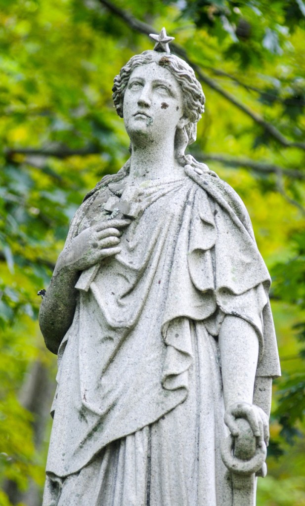 A detail shot of statue shown Friday in the Maine Avenue Cemetery in Farmingdale.