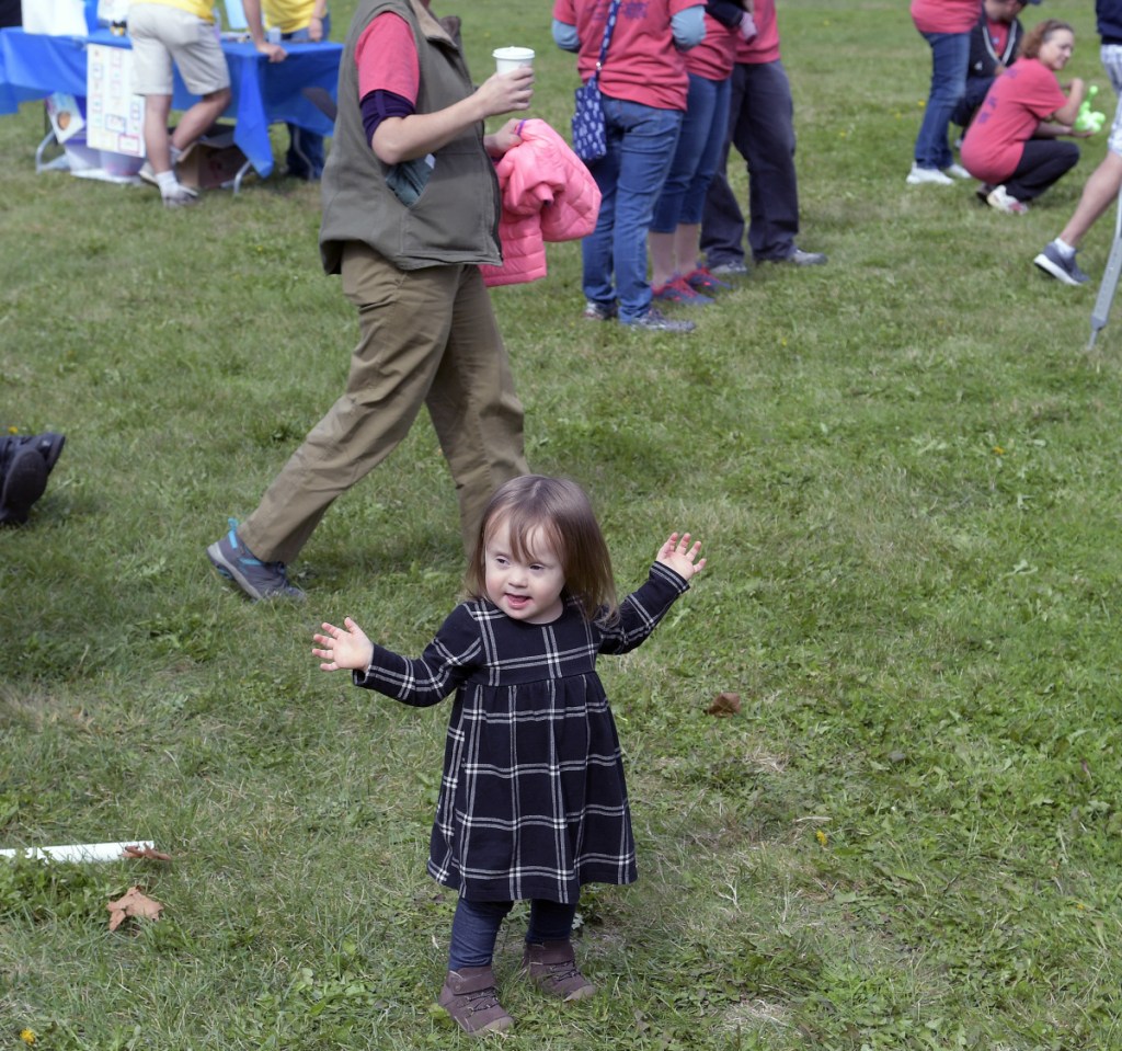 Luna Sorenson, 1, of Rumford, on Sunday takes part in the Augusta Buddy Walk, presented by the Maine Down Syndrome Network.