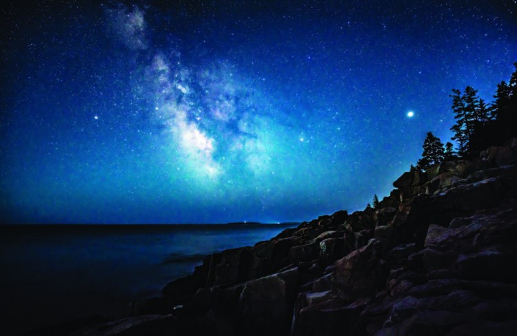 The Milky Way glimmers above the ocean off the coast of Acadia National Park early on the morning of April 23.