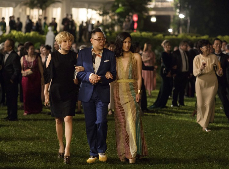 Awkwafina, left, Nico Santos and Constance Wu in a scene from "Crazy Rich Asians."
