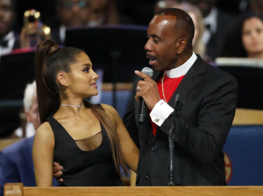 Bishop Charles H. Ellis III speaks with Ariana Grande after she performed during the funeral service for Aretha Franklin at Greater Grace Temple in Detroit on Friday.