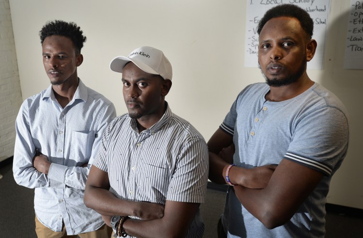 From left, Mohamed Awil, Yusuf Yusuf and Abdullahi Ali, former roommates of the author of "Call Me American," dispute his characterization of them in the book and say there are many factual errors.