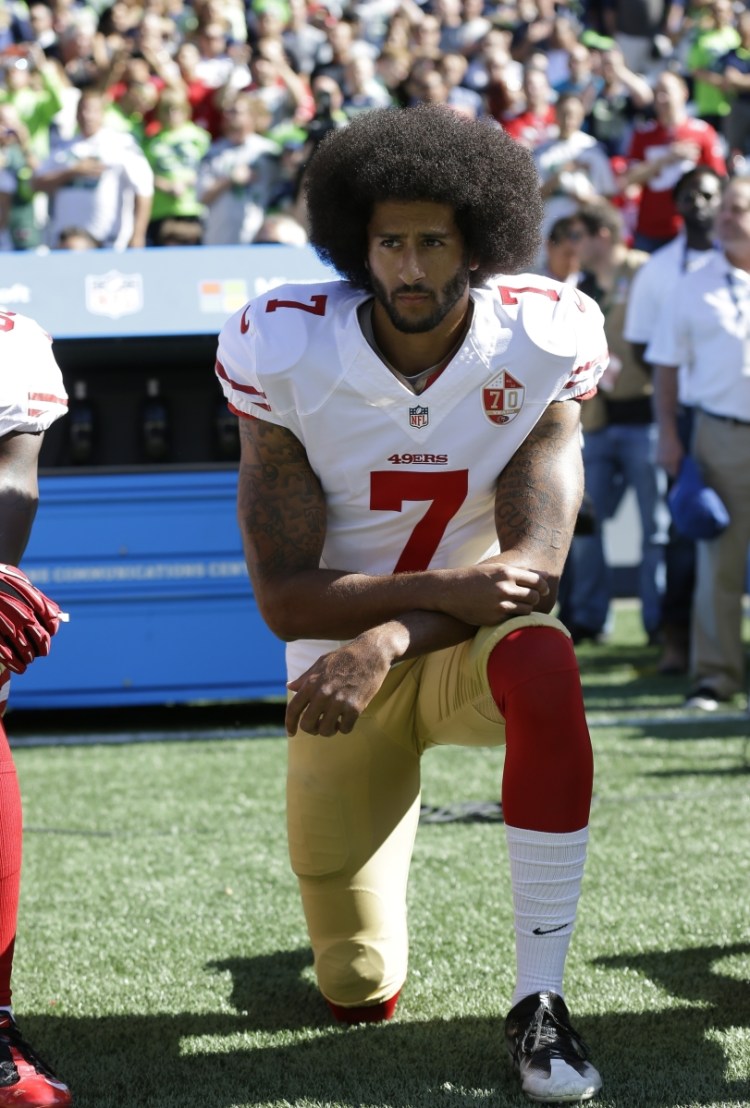 Colin Kaepernick kneels during the national anthem at a San Francisco 49ers game in 2016.