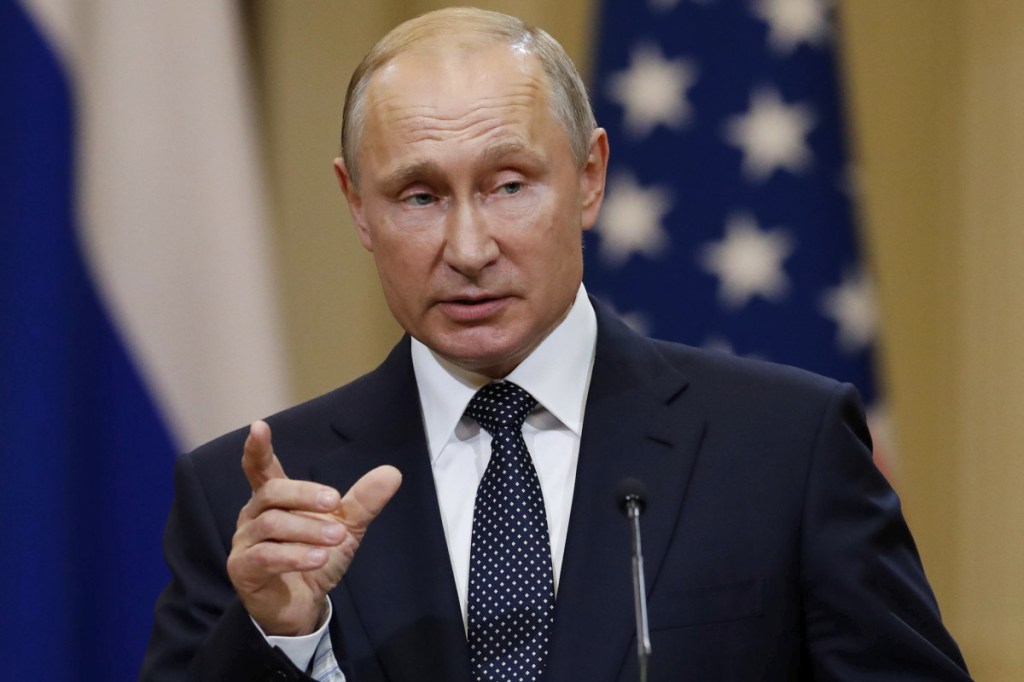In this photo taken on Monday, July 16, 2018, Russian President Vladimir Putin gestures while speaking at the joint press conference with U.S. President Donald Trump after their meeting at the Presidential Palace in Helsinki, Finland. The GRU is one arm of Russia's extensive security and intelligence apparatus, which also includes the Foreign Intelligence Service, known as the SVR, and the Federal Security Service, or FSB, which conducts domestic intelligence and counterintelligence. Associated Press/Alexander Zemlianichenko