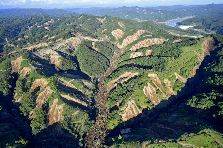 This aerial photo taken on Thursday shows the site of a landslide triggered by an earthquake in Atsuma town, Hokkaido, southern Japan. 