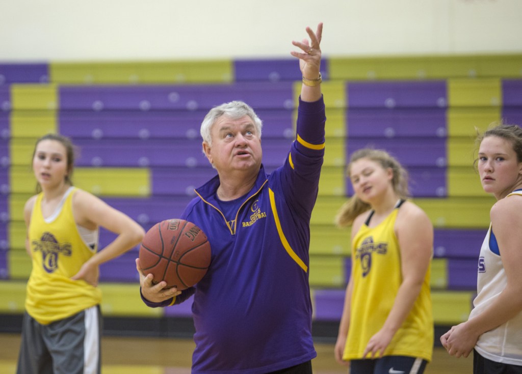Gary Fifield works with players last November during a preseason girls' basketball practice at Cheverus High. (Photo by Derek Davis/Staff photographer)