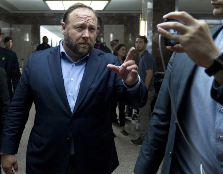 Alex Jones, the right-wing conspiracy theorist, walks the corridors of Capitol Hill on Wednesday after listening to Facebook COO Sheryl Sandberg and Twitter CEO Jack Dorsey testify before the Senate Intelligence Committee on "Foreign Influence Operations and Their Use of Social Media Platforms."