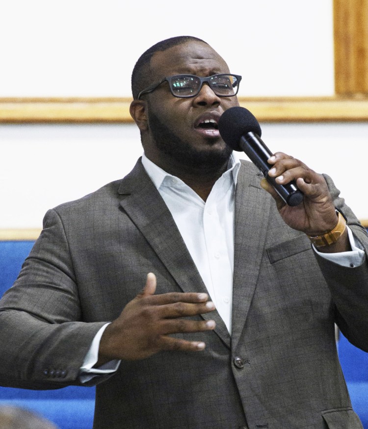 Botham Jean leads a worship service in September 2017. Authorities say a police officer mistakenly entered his apartment and killed him.