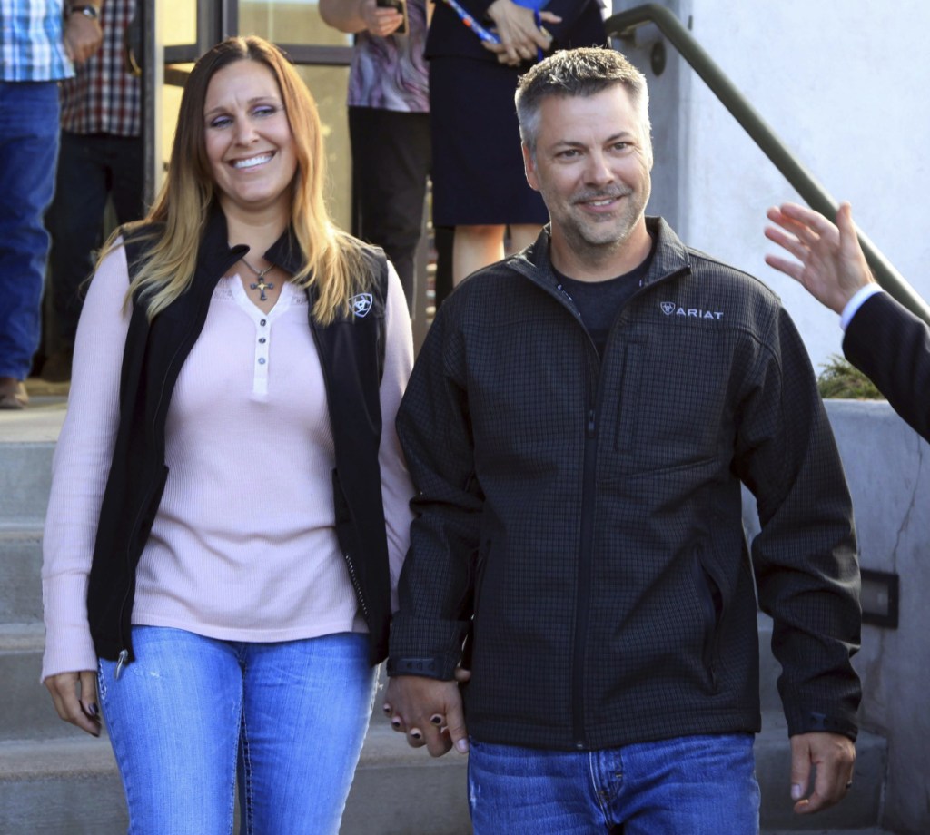 This photo provided by the Oregon Justice Resource Center shows Josh Horner with his wife Kelli Horner after a hearing in Bend, Ore., Monday, Sept. 10, 2018. A 50-year sentence in a sex abuse case against Horner was dismissed Monday by Deschutes County District Attorney John Hummel after the Oregon Innocence Project found holes in the 2017 conviction that undermined the credibility of the complainant, including that Horner had shot the dog in front of her. (Jenny Coleman/Oregon Justice Resource Center via AP)