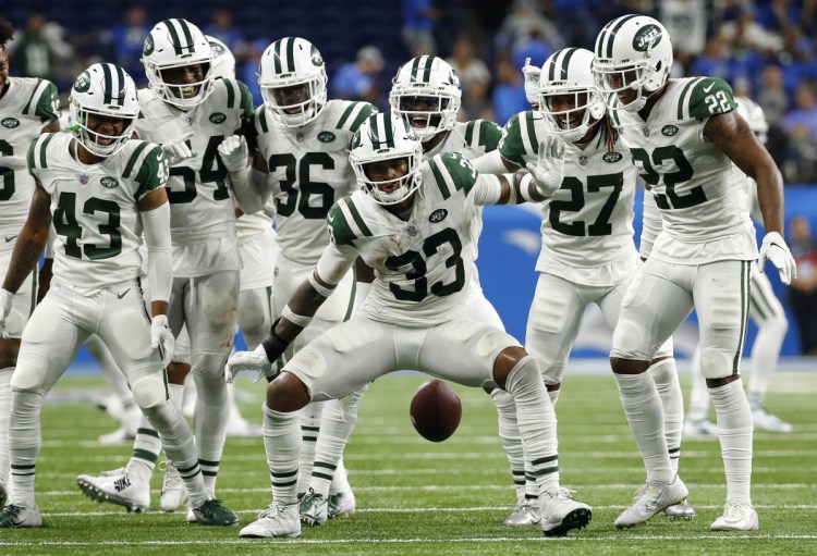 New York Jets defensive back Jamal Adams (33) celebrates his interception with teammates during the second half against the Lions in Detroit on Monday night. The Jets won 48-17.(AP Photo/Rick Osentoski)