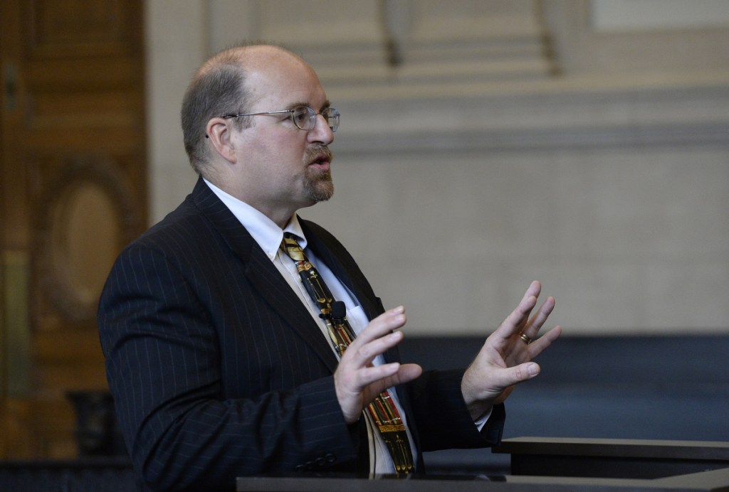 Assistant Attorney General Donald Macomber speaks before the Maine Supreme Judicial Court on Wednesday at the Cumberland County Courthouse in Portland.