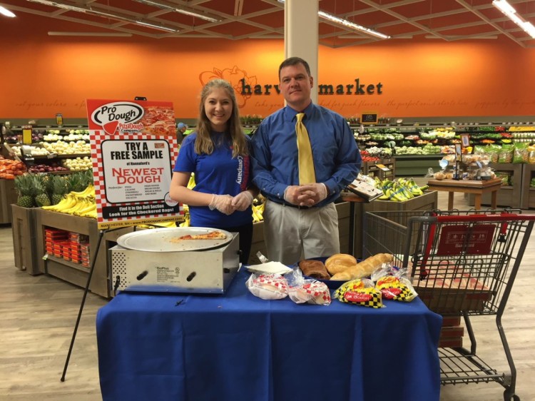 Tim Gyorda and his daughter Emily offer samples of Pro Dough at Hannaford. Gyorda is the only out-of-state, MOFGA-certified pizza dough maker.