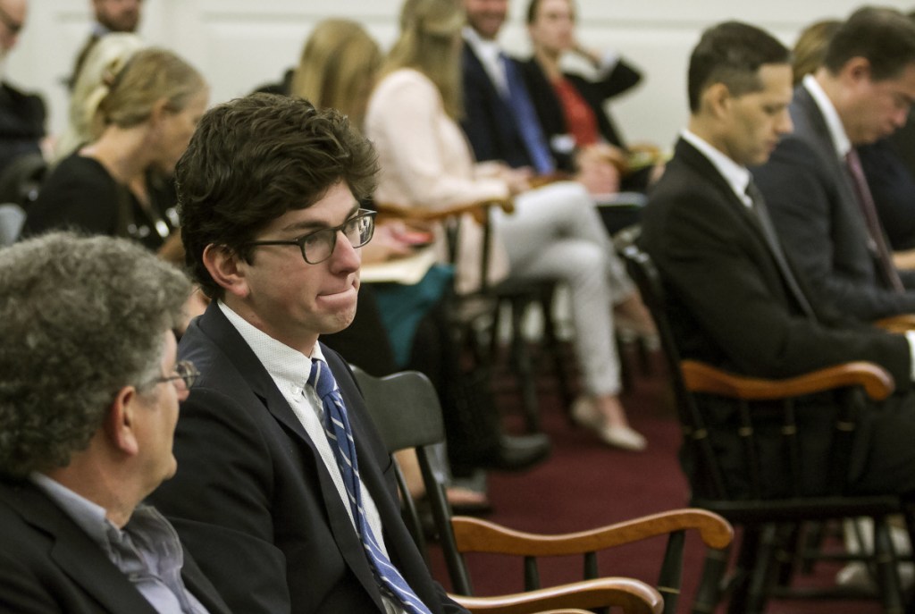 Owen Labrie, second from left, sits with his father before arguments are made before the New Hampshire Supreme Court on Labrie's request for a new trial Thursday.
