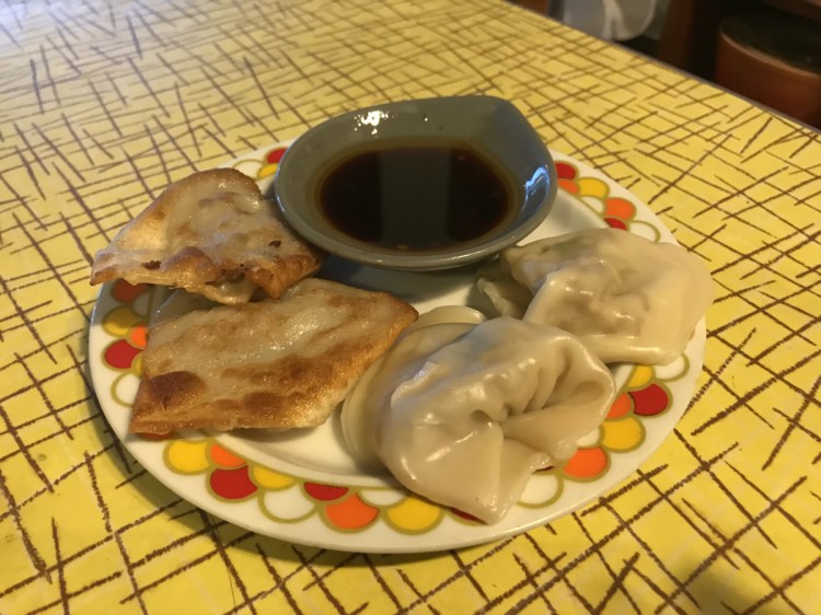 The Pork and Ginger Dumplings, a reference to Amy Tan's 'The Kitchen God's Wife,' can be boiled or pan-fried and are paired best with a sweet vinegar sauce for dipping.