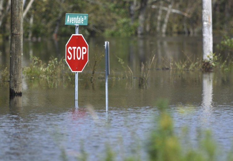 A road is flooded from Hurricane Florence in the Avondale community in Hampstead, N.C., on Friday.