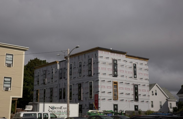 The Onejoy project, a 12-unit condo building under construction in Portland's West End. A unit in the development is being set aside as affordable housing for a middle-income family.