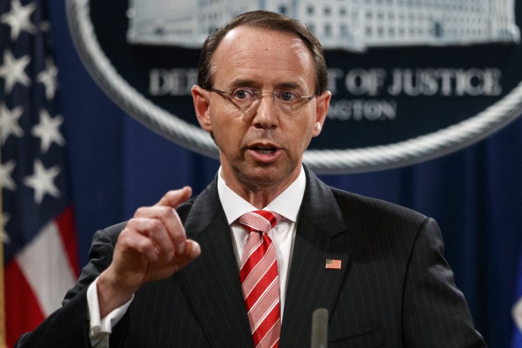 Deputy Attorney General Rod Rosenstein speaks during a news conference at the Department of Justice in Washington. Rosenstein is denying a report in The New York Times that he suggested last year that he secretly record President Trump in the White House to expose the chaos in the administration. Rosenstein said the story is "inaccurate and factually incorrect."