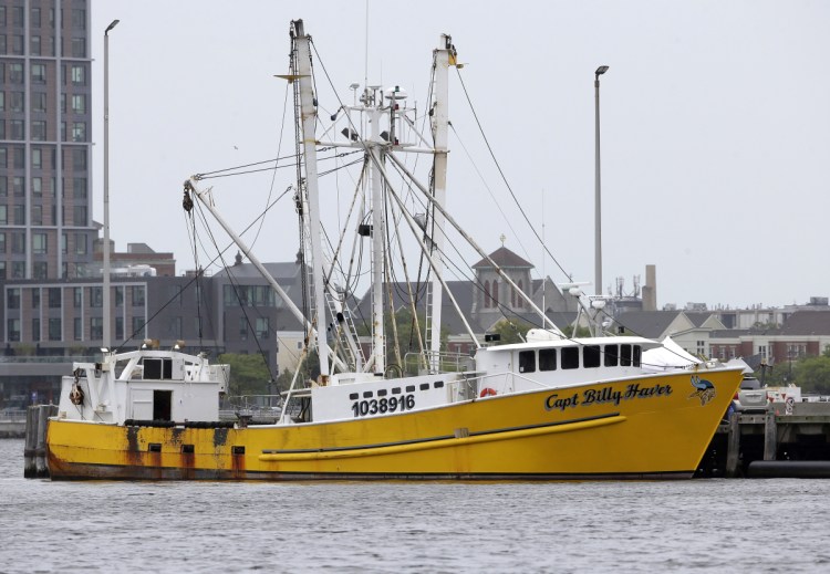 The Virginia-based fishing vessel Captain Billy Haver is docked Tuesday at the U.S. Coast Guard Station in Boston. A crew member was charged with murder and attempted murder in connection with an attack Sundayon the fishing vessel while it was underway about 55 miles off Nantucket, Massachusetts.