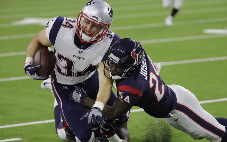 New England Patriots running back Rex Burkhead, left, ran 22 times for 86 yards in the first two games of the season, and also caught three passes for 26 yards. (AP Photo/David J. Phillip)