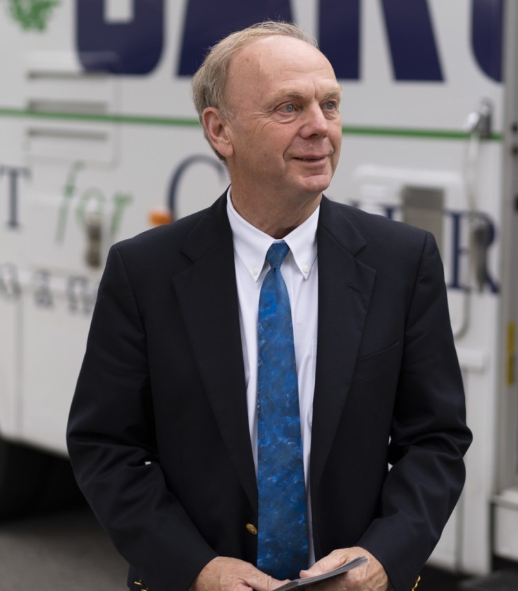 Independent gubernatorial candidate Alan Caron meets voters outside his campaign RV on a stop in Waterville.