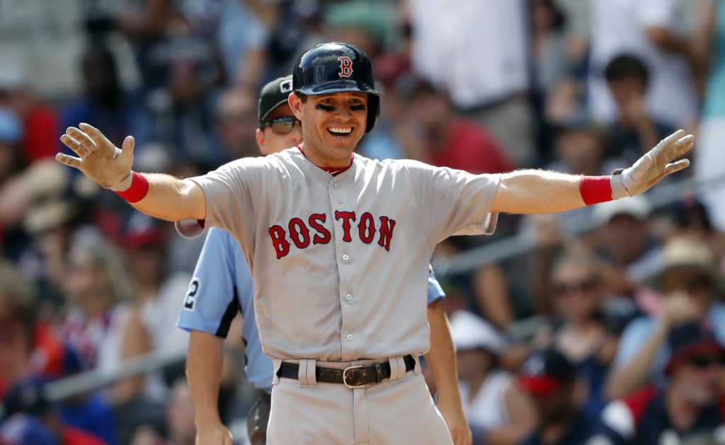 Boston Red Sox second baseman Ian Kinsler reacts after driving in two runs with a base hit in the eighth inning Monday against the Atlanta Braves in Atlanta. Boston won 8-2.